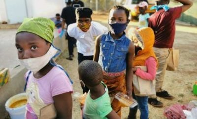 Kids receiving soup on Mandela Day in Jackson Park informal settlement